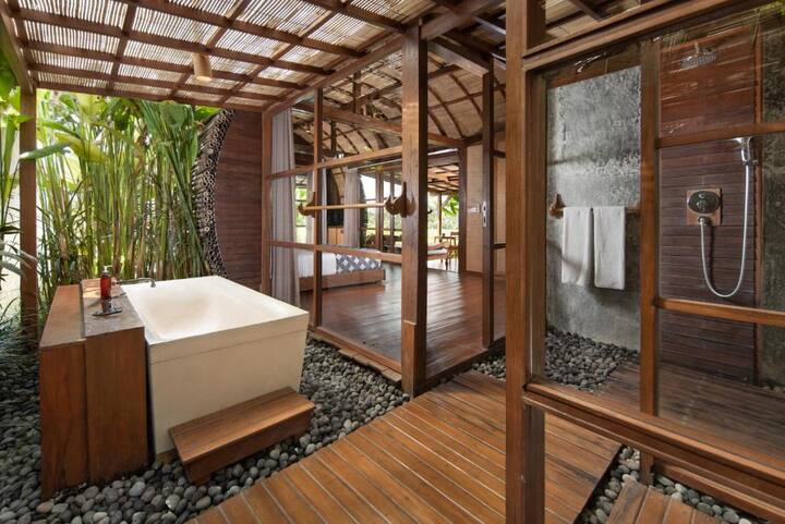 cylindrical villa surrounded by rice farms; kecamatan ubud, bali
