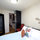 Hanging closet and floor mirror on opp. wall