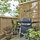 Gas grill on balcony.