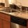 A high-end kitchen with stainless steel appliances...