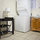 Work area can double as table for laundry folding and sorting.