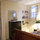 A large closet and tall chest of drawers provides plenty of storage space.