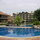 Picturesque - Large children's pool with waterslide, adult pool with bridge and island seating, and club house...