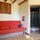 One corner of the downstairs living area with the adjoining bathroom.