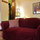 Seating. Queen size bed & Entrance to the bathroom.