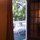 view onto the balcony...backyard shaded with trees