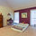 this is the QUEEN bedroom,  NOW has a nice wicker bedroom suite, not the futon on the floor and the wood chest as shown as shown!