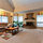 light airy front living room has fireplace, 5 windows and TV, VCR, Tivo