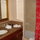 Bathroom in bedroom with granite countertops, spa tub and shower.