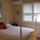 very comfortable room with a view of the mountains and swaying palm trees from your bed