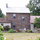 Back of the house with large deck and grill.