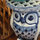 A ceramic owl holds a jade plant in the master bedroom.