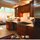 Kitchen with living room in background.