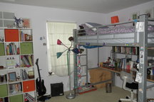 cozy single loft bed, with desk