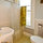 Bathroom has many useful toiletry items provided. 