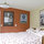 Queen bed in cabaña looking back toward living area