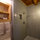 Large, walk-in shower with plenty of fresh linens