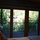 Master bedroom with drapes open: view onto downstairs deck