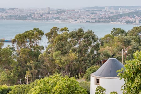 Cozy 1850s Windmill with City and River Sunset Views