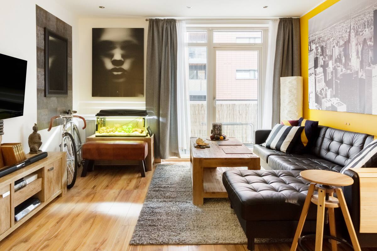 Comfy Room in a Fun, Photography-Filled Apartment