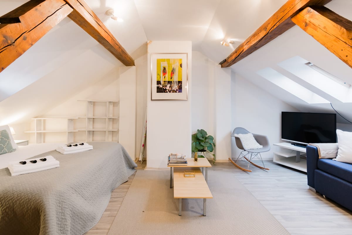 Overlook the Castle from a Cool, Cozy Attic Hideaway