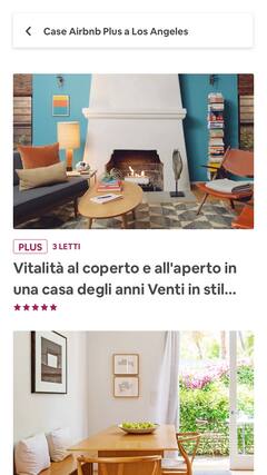 Un soggiorno con arredi moderni e una cucina luminosa e ariosa.
