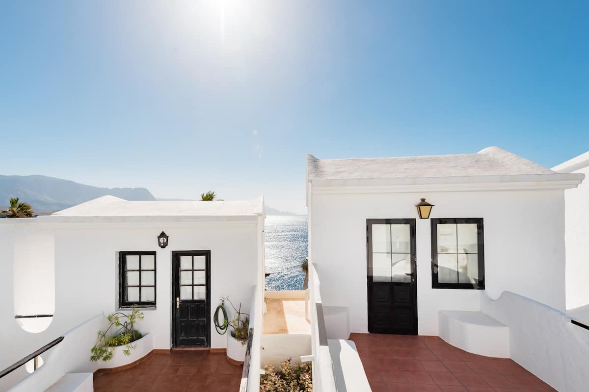 Watch Ocean Sunsets from a Modern Apartment with a Pool