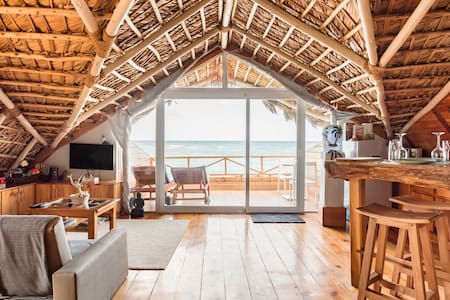 Rekindle a Romance in a Retro Thatched Hut on the Beach