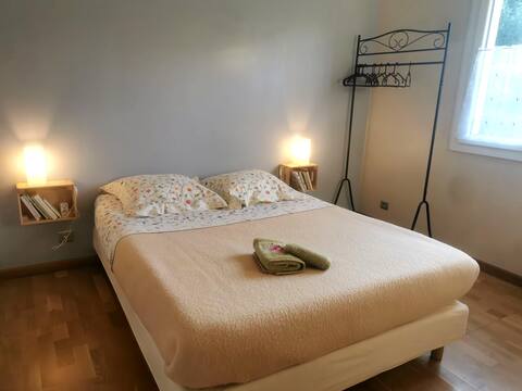 Bedroom with private bathroom in detached house.