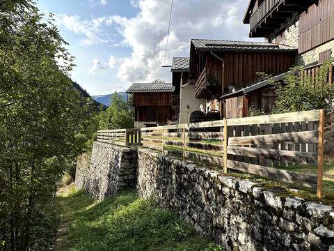 Mountain chalet with two barns and a garden