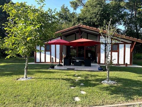 Typical Landes house by the lake and forest