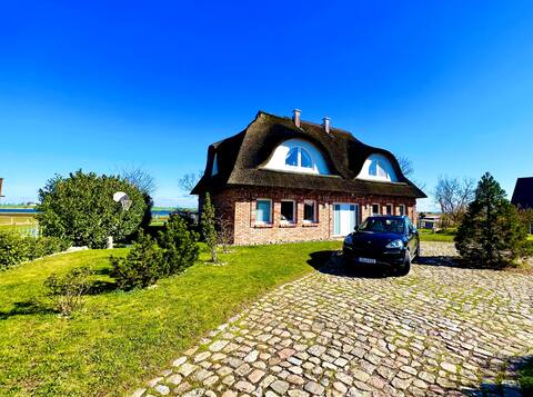 Gorgeous thatched roof house with water views