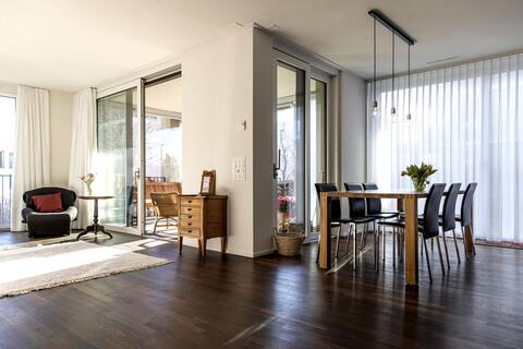 Bright, modern apartment with garden seating