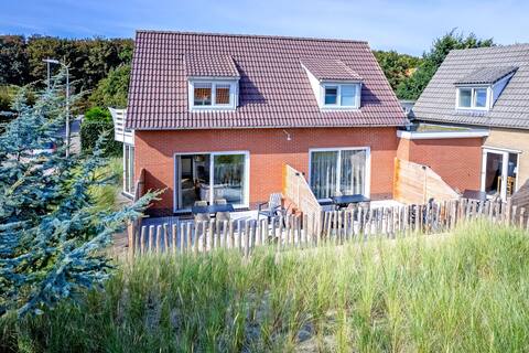 Holiday home of De Leeuwerik with view of the dunes