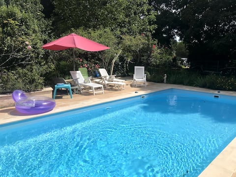 Longhouse with wooded park and pool