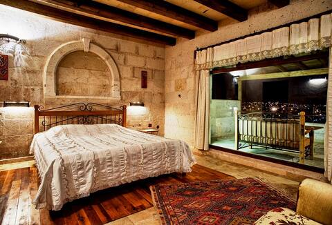 cozy stone house with fireplace and terrace