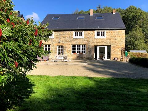 Warm stone house with pond
