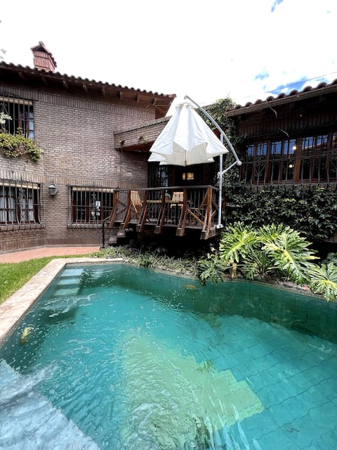 Centrally located house with swimming pool and large garden