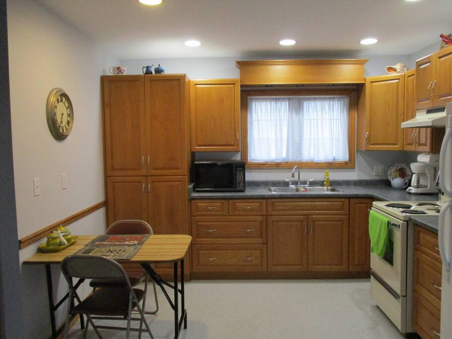 frig, microwave, toaster oven, coffee maker, stove with oven, non-slip linoleum