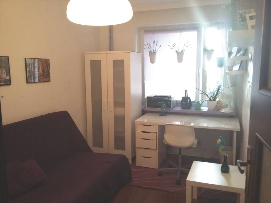 Room for rent with comfortable sofa for 2-people.