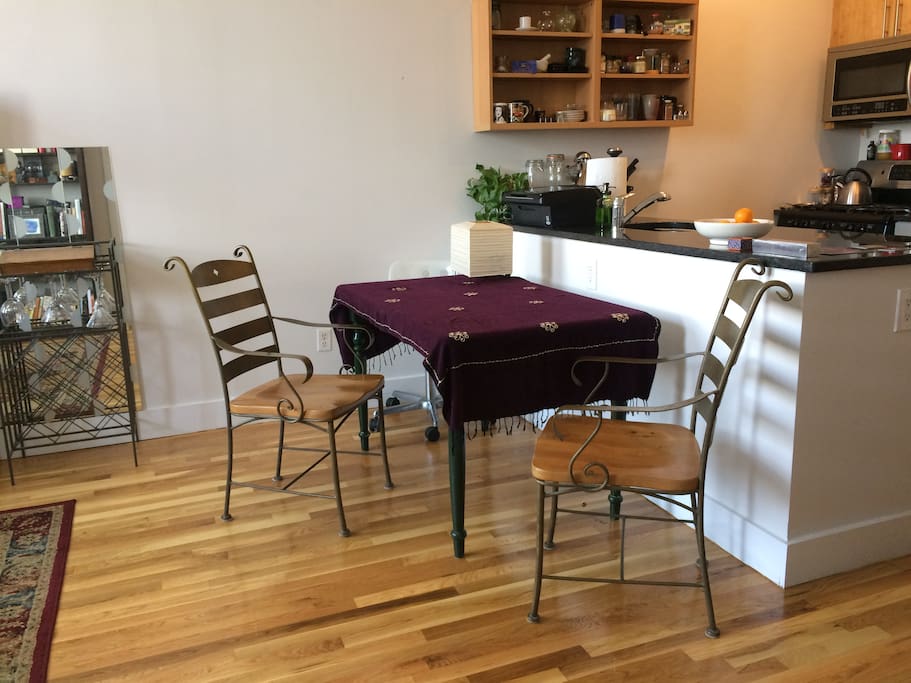 View towards kitchen with dining room table and chairs.