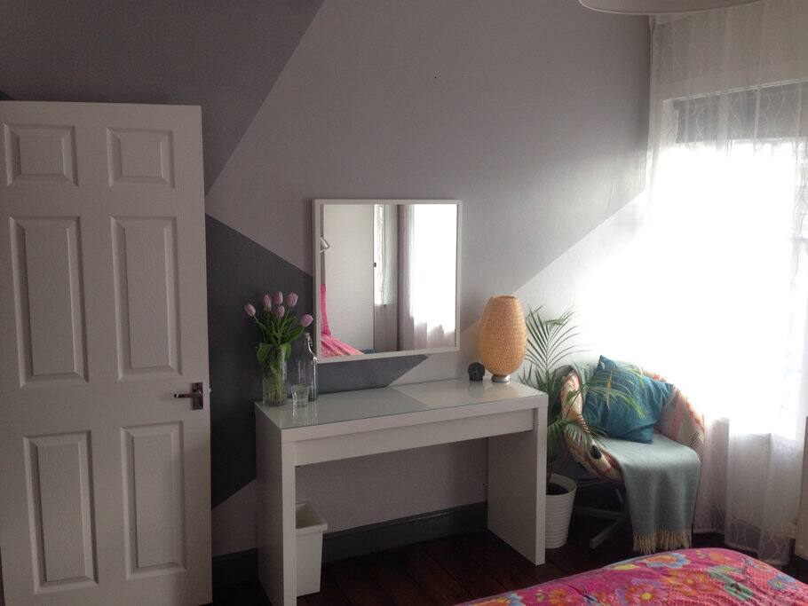 Master bedroom with desk and chair