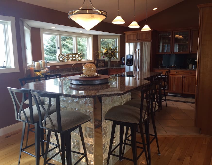 Chef's kitchen with plenty of space for guests to enjoy the view and socialize