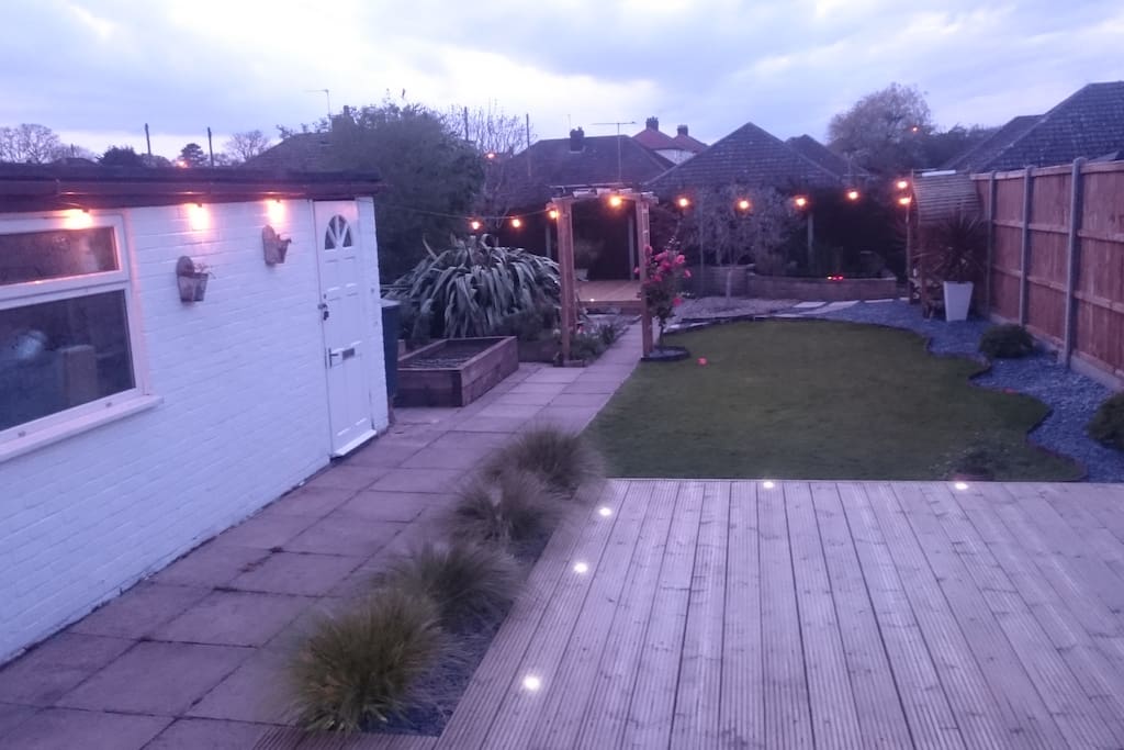View on the beautiful and secluded back garden from the conservatory at dusk