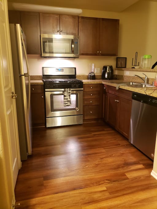 Luxury Stanley steel appliances fully equipped with granite countertops, great for cooking..
