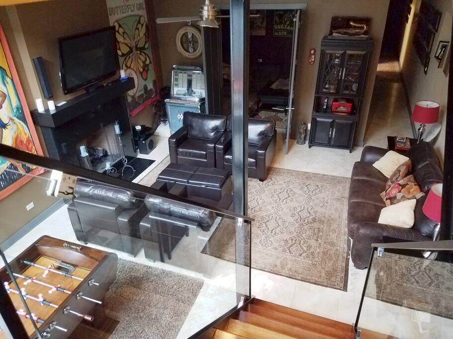 Game Room, sitting area & Fireplace from Private Staircase leading to designated door.