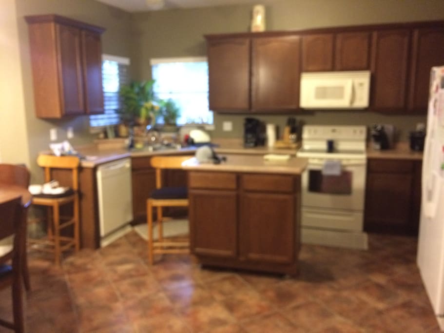 Full kitchen with dishwasher, microwave/range and water view
