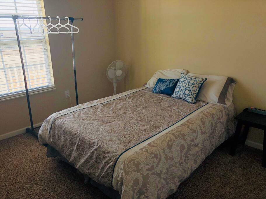 Your memory foam, full size mattress. Including a fan and place to hang your clothes.