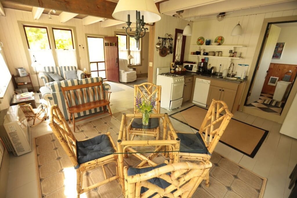 This view is from the dining room looking toward the living room and front door. The bathroom is off the kitchen