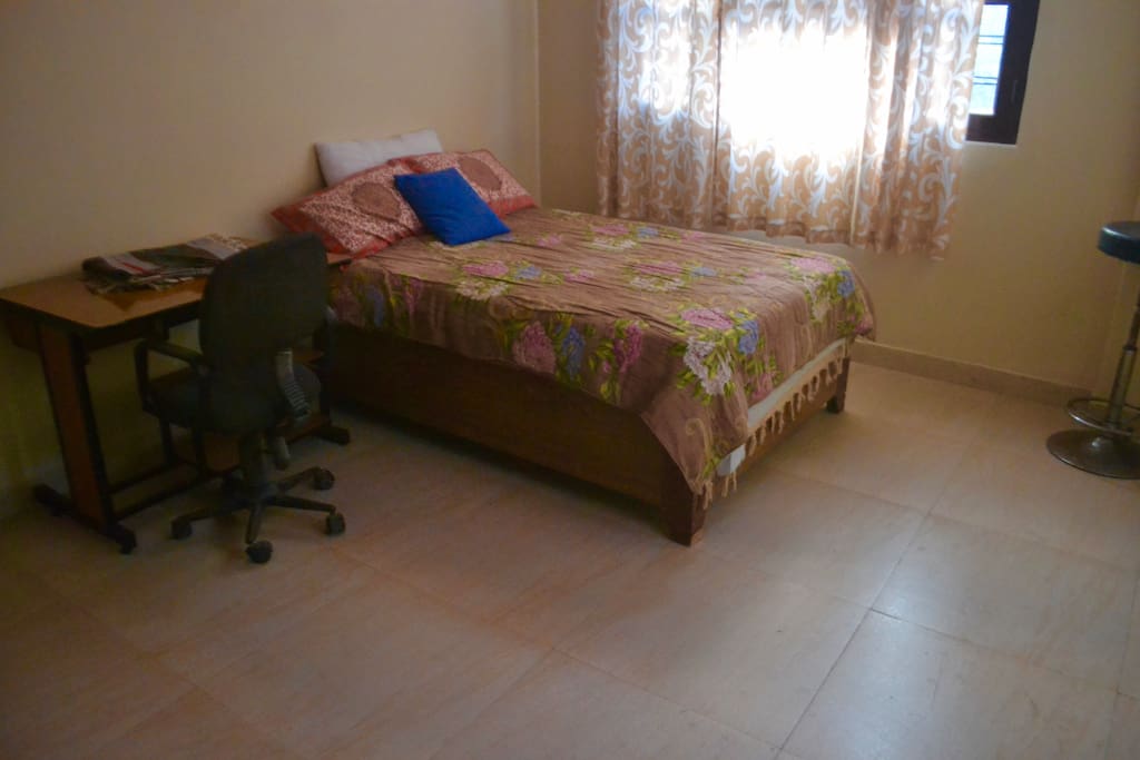 Queen sized bed perfect to comfortably fit two people.
